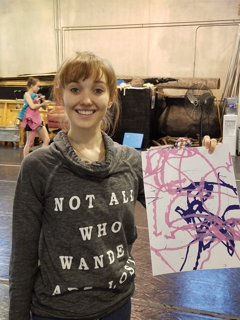 Eleanor – Eleanor holding up the completed painting