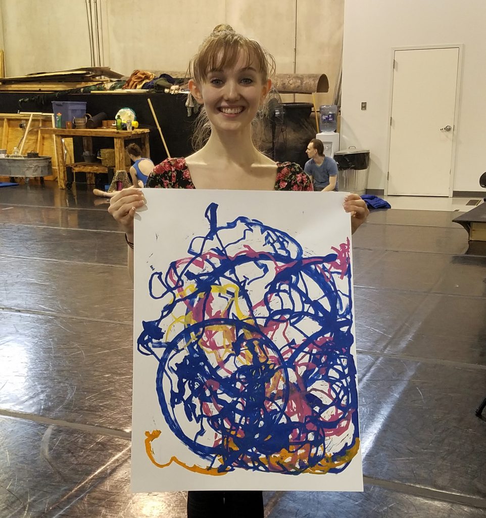 Eleanor in Match Point – Eleanor holding the Match Point painting